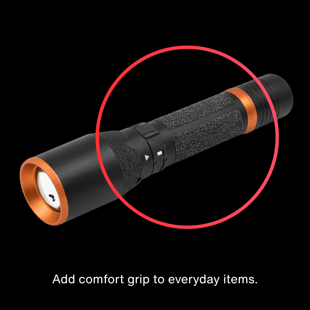 Black flashlight with orange accents on a black background